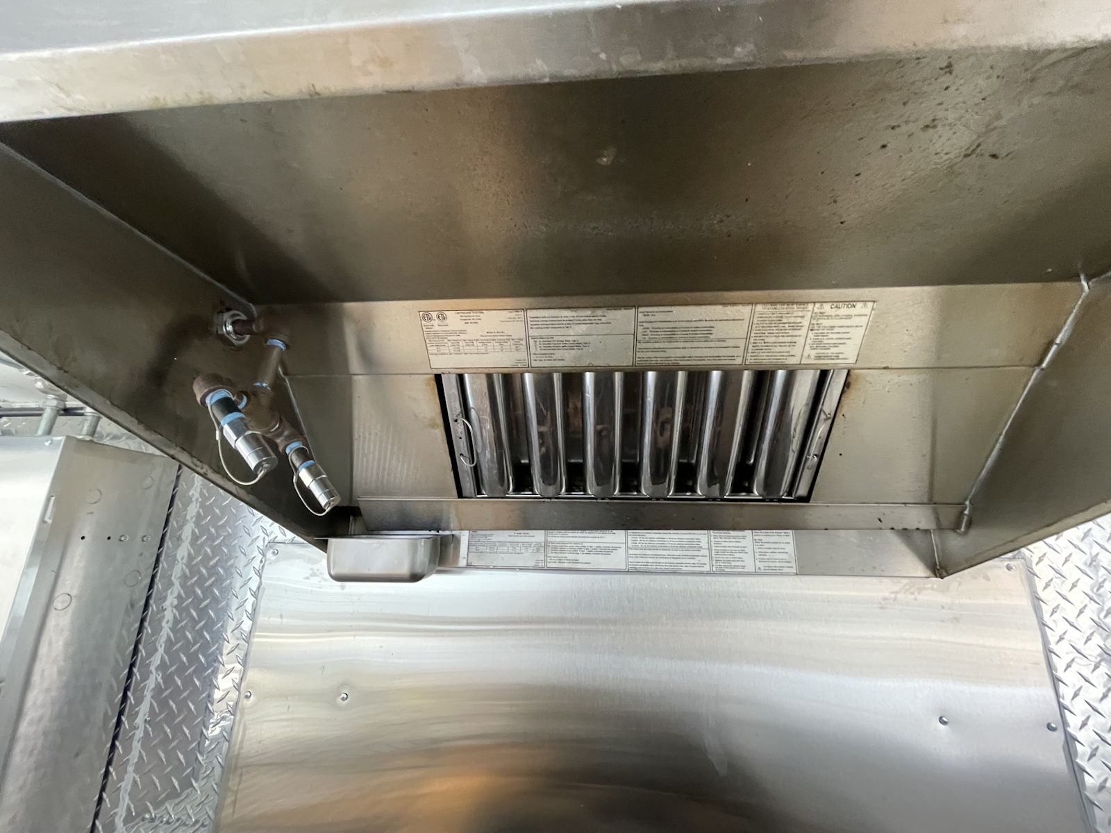 Commercial kitchen interior inside food truck - kitchen photo 13