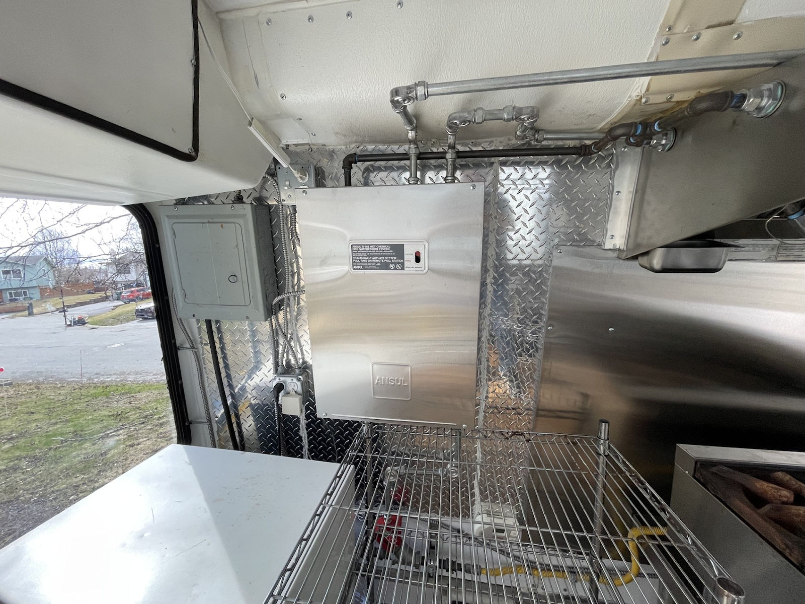 Commercial kitchen interior inside food truck - kitchen photo 16
