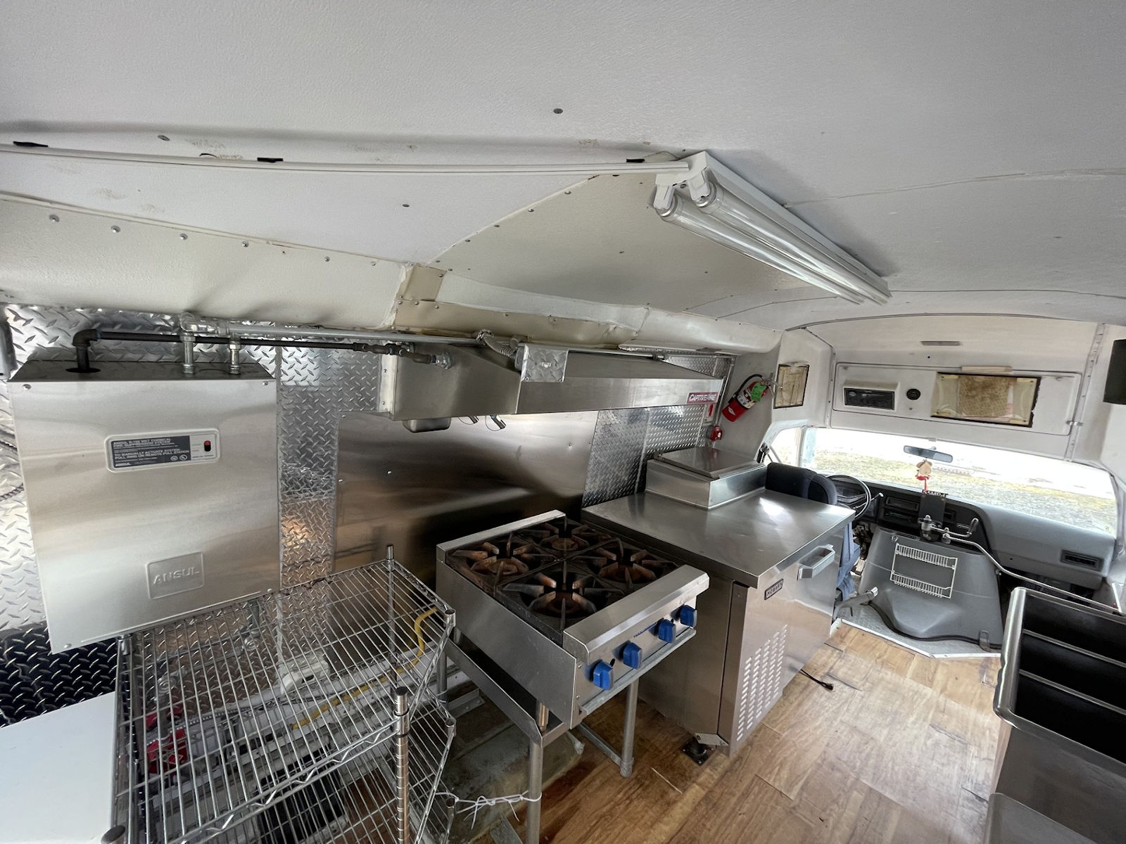 Commercial kitchen interior inside food truck - kitchen photo 19
