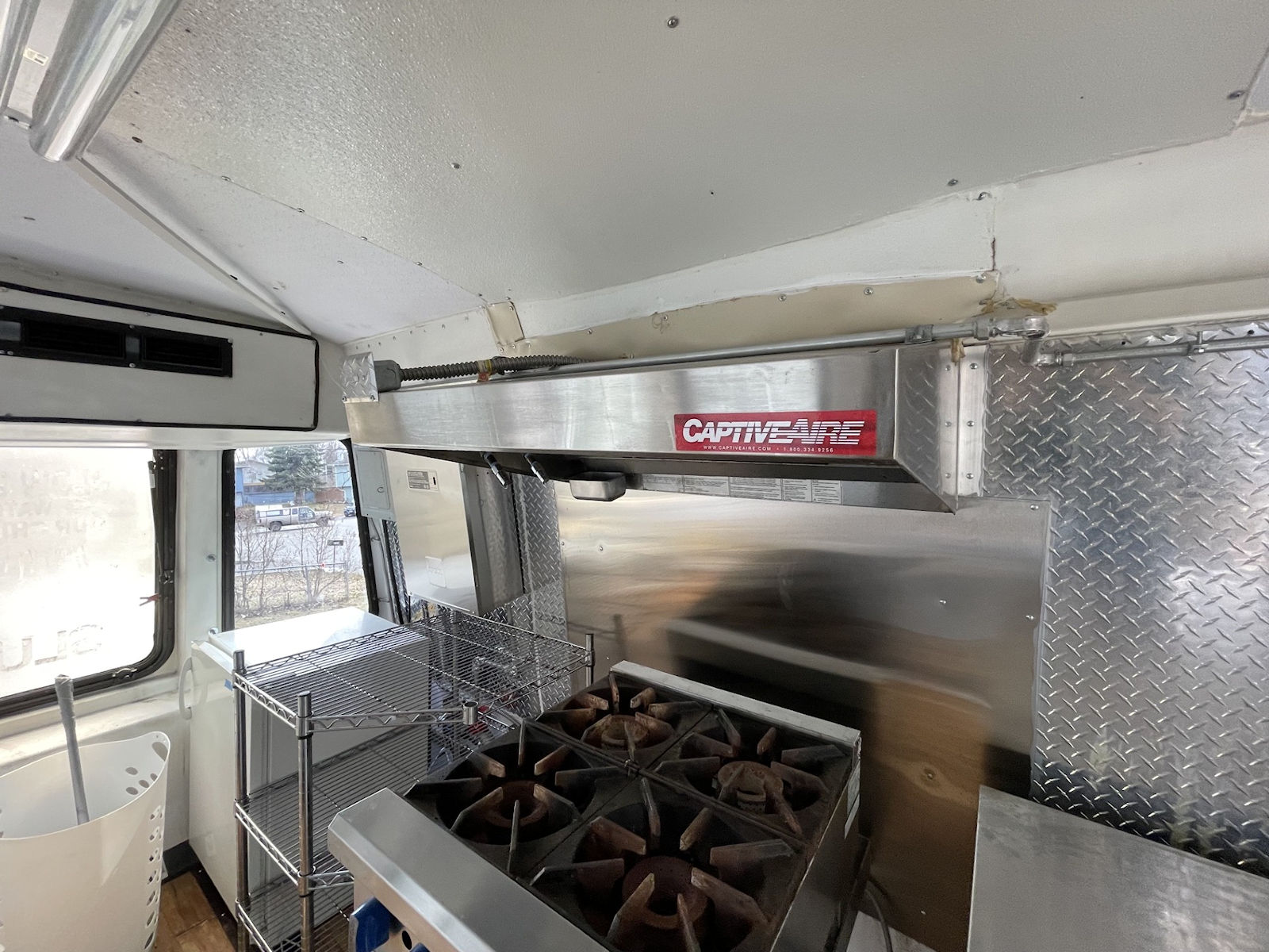 Commercial kitchen interior inside food truck - kitchen photo 9